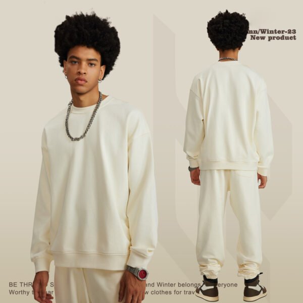 Custom Heavyweight Oversized Terry Sweatshirt W0175 - Style 6B548B Man wearing a cream oversized cotton terry sweatshirt and matching sweatpants