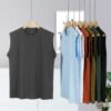 Assortment of unisex sleeveless vests in various colors hanging on a rack