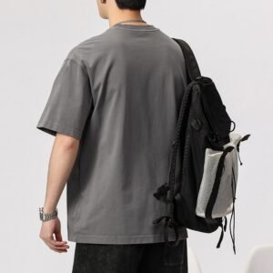 Man wearing a grey vintage wash heavyweight t-shirt