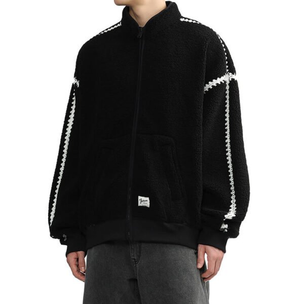 Black patchwork fleece jacket with white trim and high stand collar