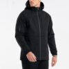 Custom Men's Hooded Technical Shell Jacket | VWW-JKT-5187 - Style 518731 Man wearing a black hooded technical jacket with zippered pockets.