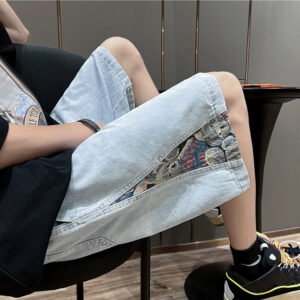 Light blue washed denim shorts with patterned side panel detail