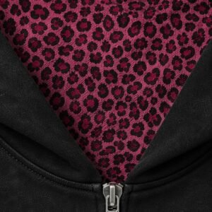 Close-up of a black hoodie with pink leopard print lining