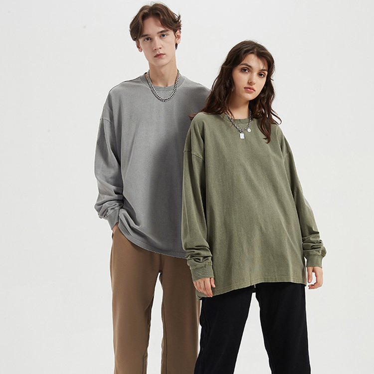 Couple wearing washed grey and olive green oversized pullover hoodies