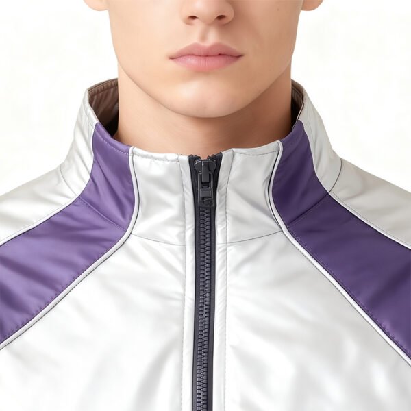 Close-up of a metallic color-block zip track jacket with purple accents