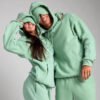 Custom Mint Fleece Hoodie and Jogger Set - Style 62C306 Couple wearing matching mint green fleece hoodie and jogger set
