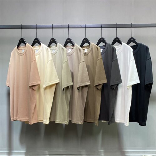 Group of plain oversized t-shirts in various neutral colors