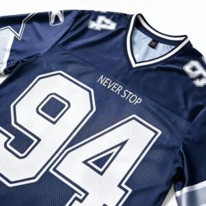 Navy mesh v-neck team jersey with 'NEVER STOP' and '94'