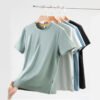 Custom 200 GSM Outdoor Crewneck T-Shirt - Style BCAFDD Four quick-dry outdoor t-shirts in different colors hanging on a rack.