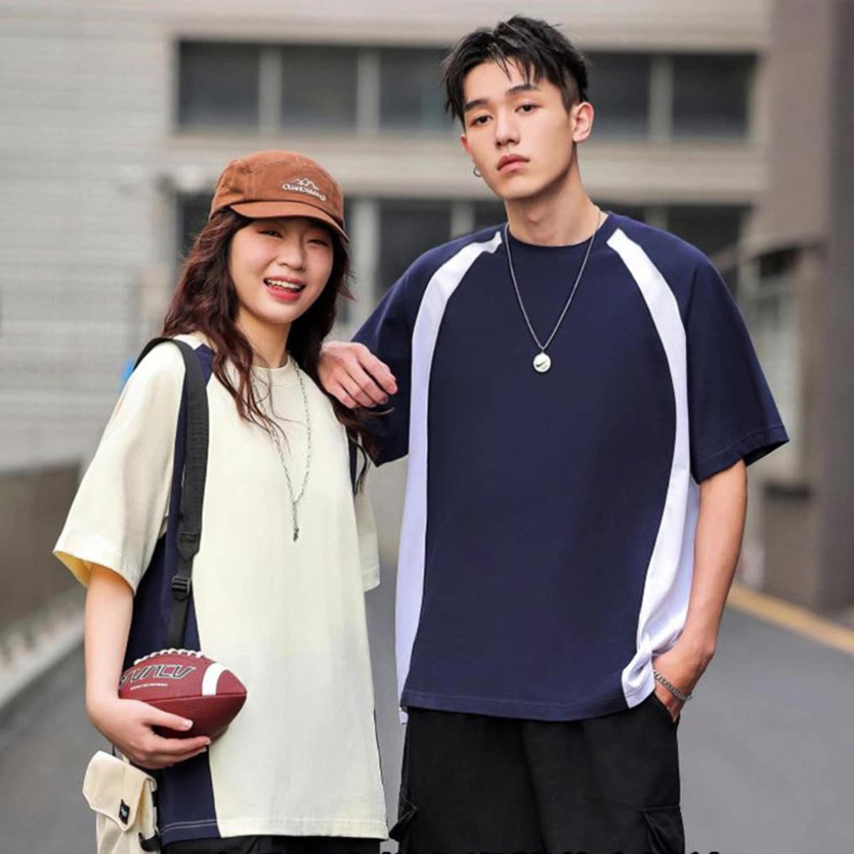Couple wearing oversized colorblock raglan sleeve t-shirts
