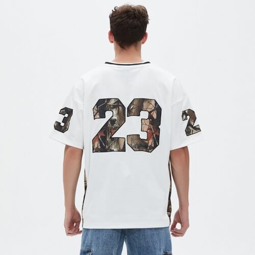 Back view of an oversized white football jersey with camo print number 23