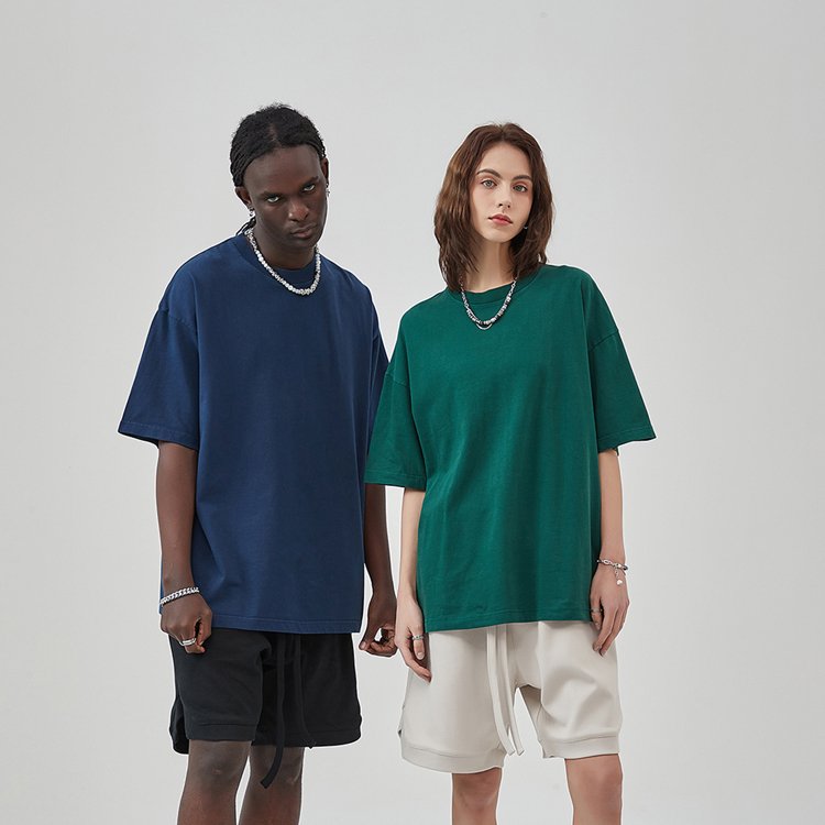 Man and woman wearing oversized blank streetwear t-shirts