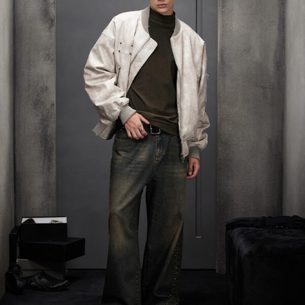 Light grey vintage-washed oversized bomber jacket with studded details.
