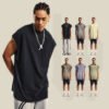 Custom Vintage Oversized Cotton Tank Top S1531 - Style 45E3D9 Man wearing a custom oversized washed cotton tank top in black, with other colors shown.