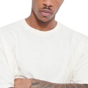 Man wearing a plain cream oversized crew neck t-shirt