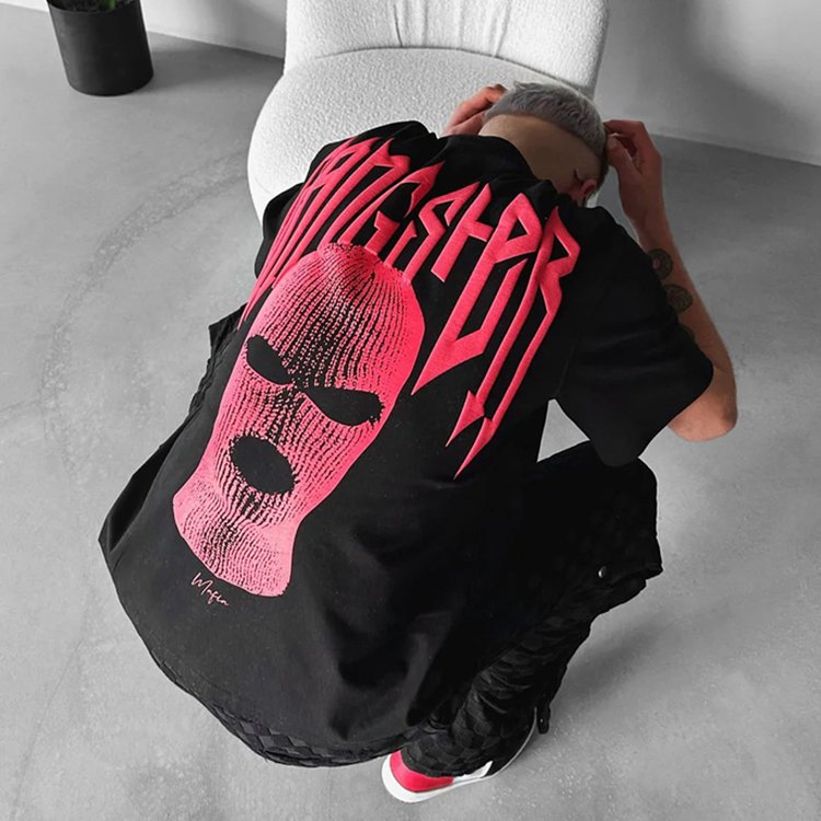 Black oversized t-shirt with a pink balaclava graphic and 'Waffen' text