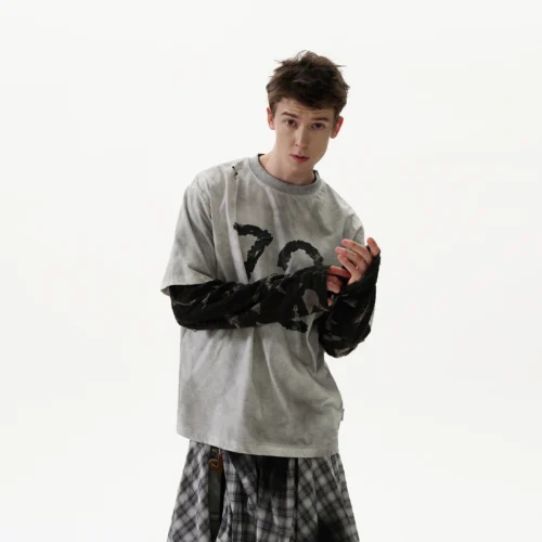 Model wearing an oversized distressed t-shirt with '72' graphic