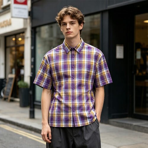 Custom Oversized Plaid Short-Sleeve Shirt - Style 87E838 Man wearing an oversized purple and yellow plaid short-sleeve shirt.