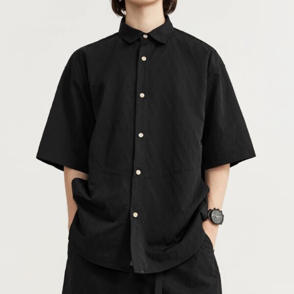 Custom Oversized Polyamide Textured Short-Sleeve Shirt CUS24039121S24 - Style B91668 Man wearing a black textured oversized short-sleeve collared shirt