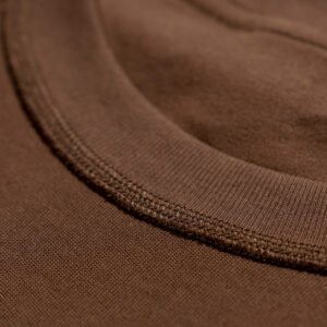 Close-up of a brown oversized streetwear t-shirt neckline