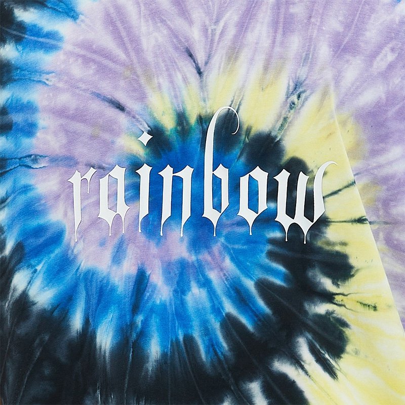 Close-up of an oversized tie-dye t-shirt with the word 'rainbow' in a gothic font