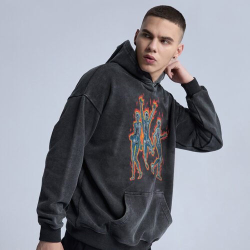 Man wearing a dark gray washed oversized graphic pullover hoodie with skeleton print