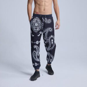 Navy jogger sweatpants with a white paisley print and drawstring waist.