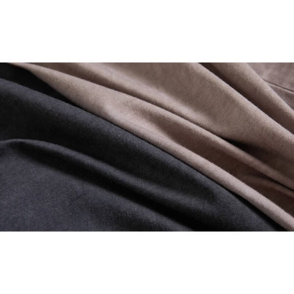 Close-up of two fabric swatches, one dark grey and one beige