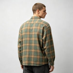 Man wearing a green and tan plaid long-sleeve button-up shirt
