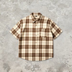 Cream and brown plaid short sleeve button-up shirt with a pocket
