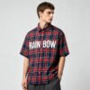 Custom Plaid Oversized Short-Sleeve Shirt - Style B6C993 Man wearing a red and navy plaid short-sleeve shirt with RAINBOW text