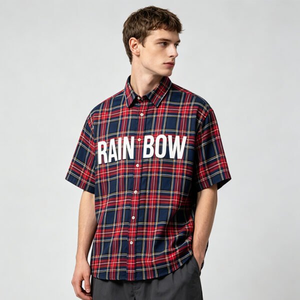 Custom Plaid Oversized Short-Sleeve Shirt - Style B6C993 Man wearing a red and navy plaid short-sleeve shirt with RAINBOW text