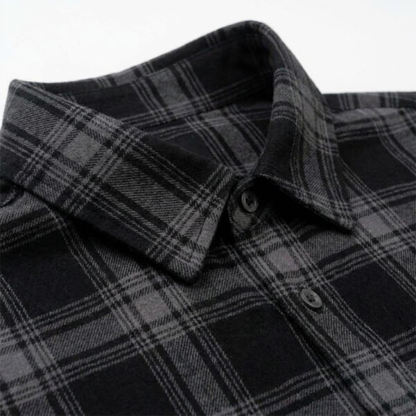 Custom Black Plaid Oversized Shorts - Style 288507 Close-up of a black and grey plaid collared shirt
