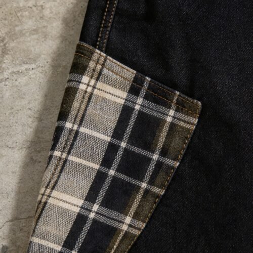 Dark wash denim capri jeans with plaid patchwork detail.