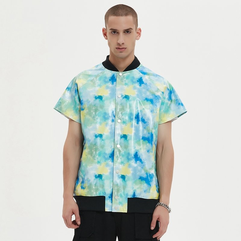Man wearing a short-sleeve faux-leather varsity jacket with abstract print