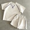 Cream t-shirt and shorts set with navy contrast piping