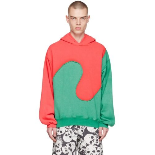 Man wearing a red and green color-block hoodie with raw edges