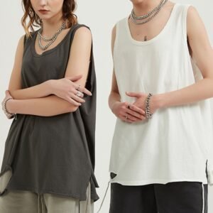Two models wearing oversized raw-edge sleeveless training tops, one dark grey and one white.