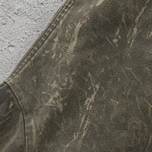 Close-up of a distressed olive green hooded canvas jacket with a textured washed finish.