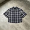 Custom Raw-Hem Plaid Shirt with Graphic Panel Layout - Style 5A2562 Black and white plaid short-sleeve shirt with raw hem and graphic flame design.