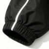 Custom Reflective Patchwork Hooded Jacket - Style 98EF81 Close-up of a black jacket sleeve with a reflective stripe