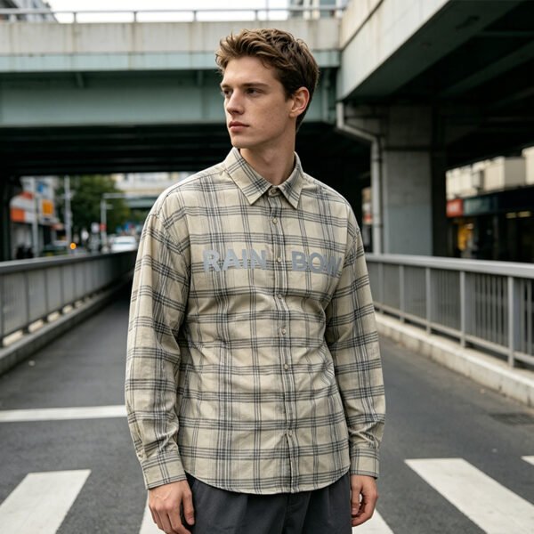 Custom Long Sleeve Plaid Reflective Print Shirt - Style 16B5CE Man wearing a beige plaid long-sleeve shirt with reflective 'RAINBOW' text