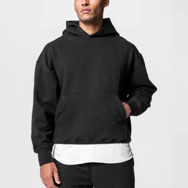 Custom Relaxed Pullover Hoodie | - Style D13EB1 Man wearing a black relaxed fit pullover hoodie.