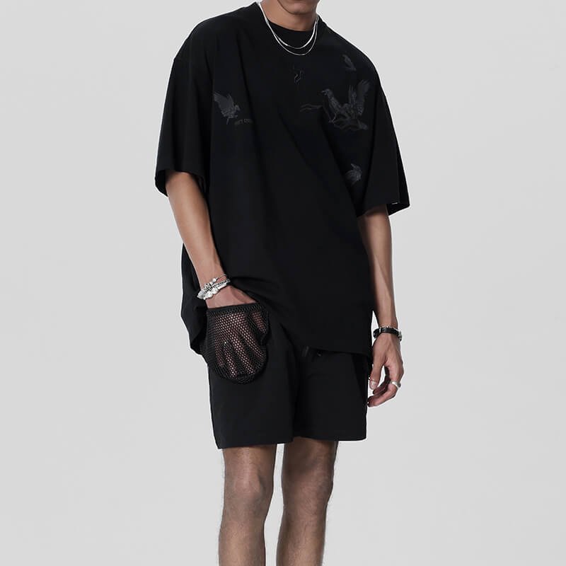 Black relaxed fit streetwear shorts with mesh pocket detail
