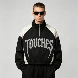 Black and white color-block crop jacket with rhinestone text