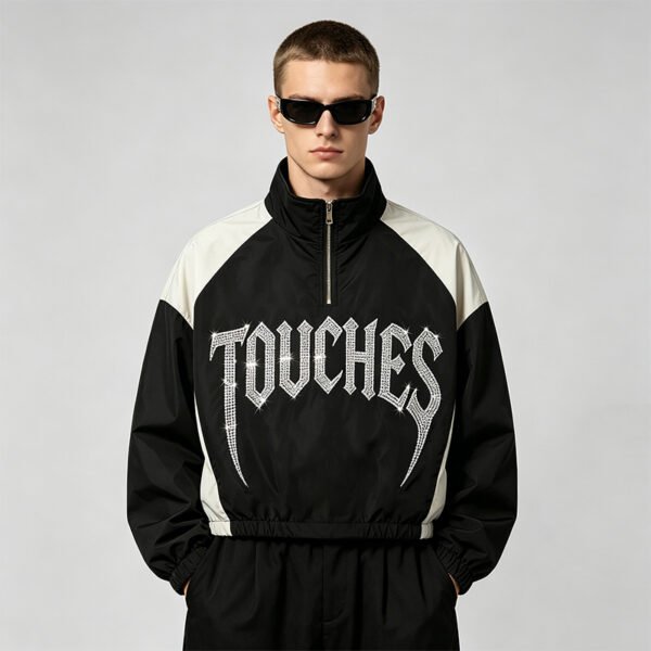 Black and white color-block crop jacket with rhinestone text