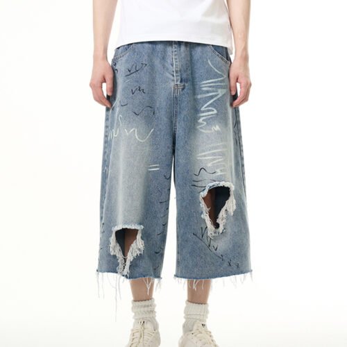 Custom Graffiti Ripped Washed Denim Shorts - Style C7EF89 Man wearing light-wash ripped denim shorts with graffiti-style markings