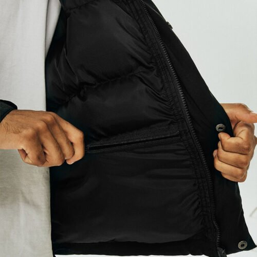 Custom Short Puffer Streetwear Jacket | VW-P21FWS12 - Style C4D12A Close-up of a black puffer jacket interior with zippered pocket