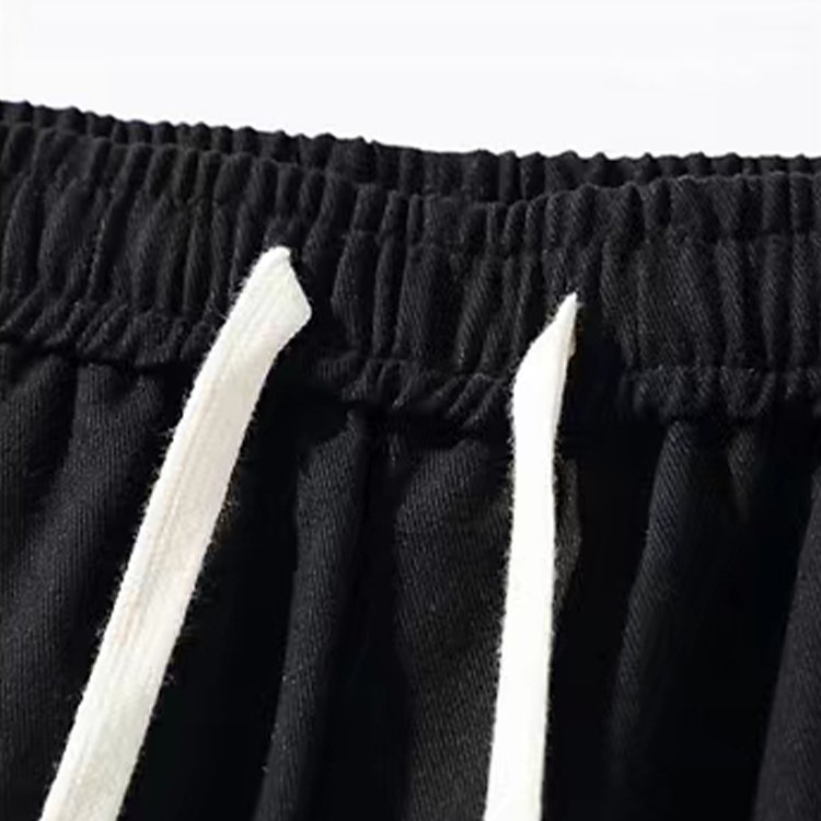 Black jogger sweatpants with drawstring and side zip detail