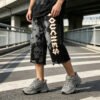 Custom Washed Skull Graphic Ripped Cropped Pants - Style AB9908 - product detail view 7 Custom Washed Skull Graphic Ripped Cropped Pants - Style AB9908 - product detail view 7